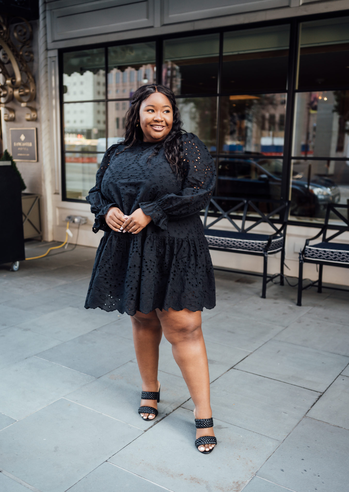 From Head to Curve in a black lace plus size dress for a date night outfit with braided amazon heels.