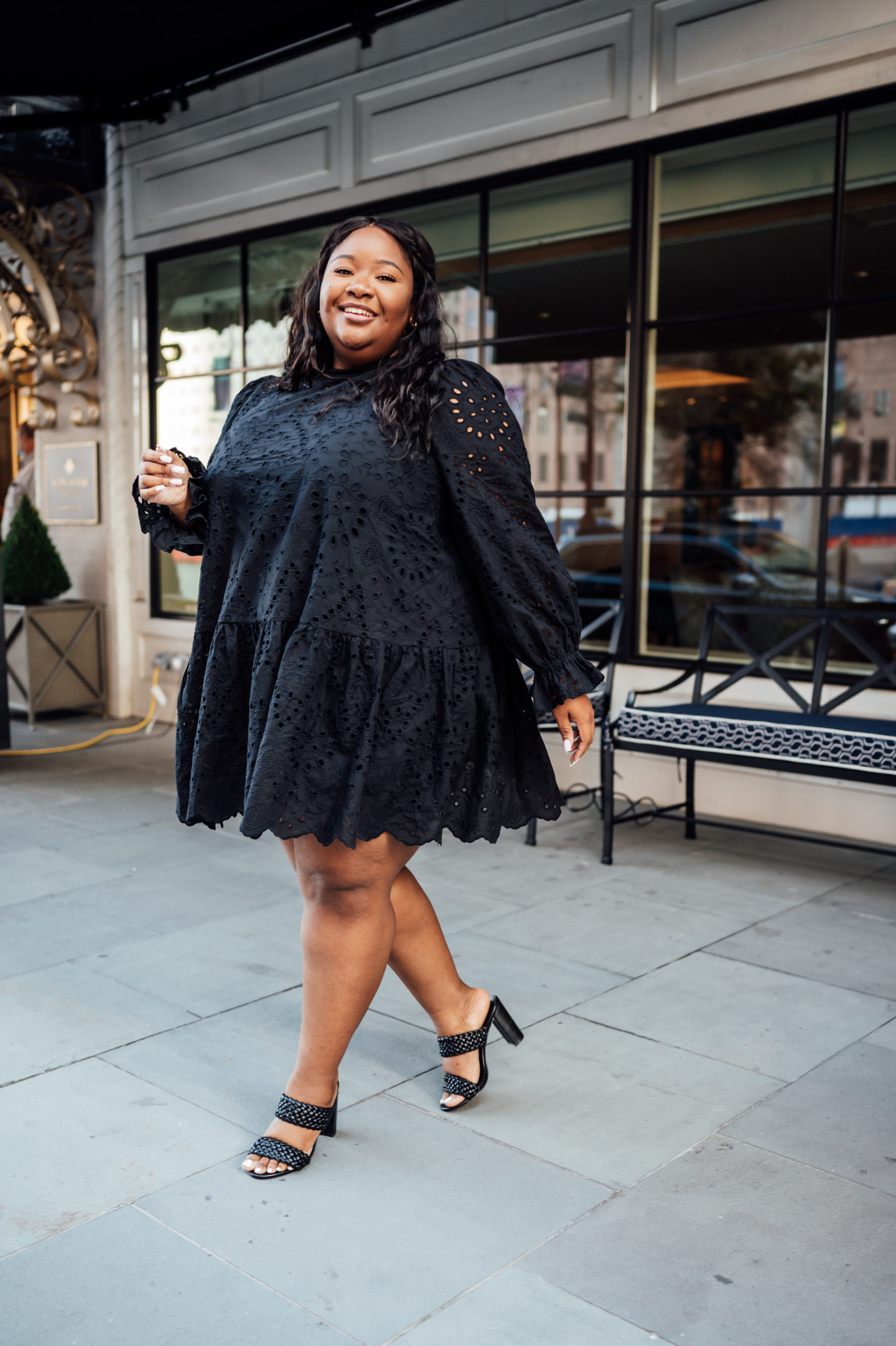 From Head to Curve in a black lace plus size dress for a date night outfit with braided amazon heels.